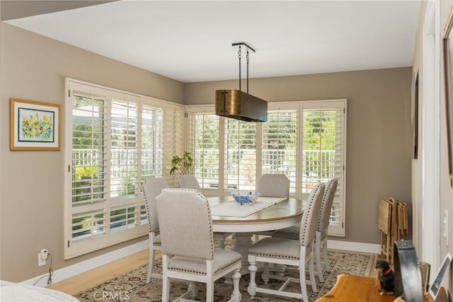 8009 E Eucalyptus Trl, Orange, CA 92869 - dining space featuring baseboards and wood finished floors