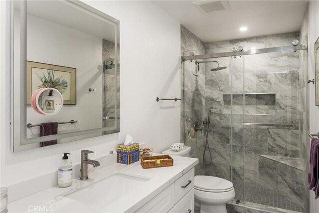 8009 E Eucalyptus Trl, Orange, CA 92869 - bathroom featuring vanity, a marble finish shower, and recessed lighting