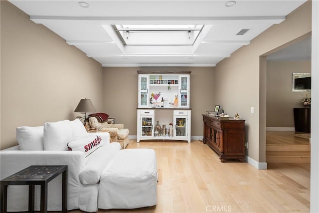 8009 E Eucalyptus Trl, Orange, CA 92869 - living area featuring light wood finished floors and a skylight