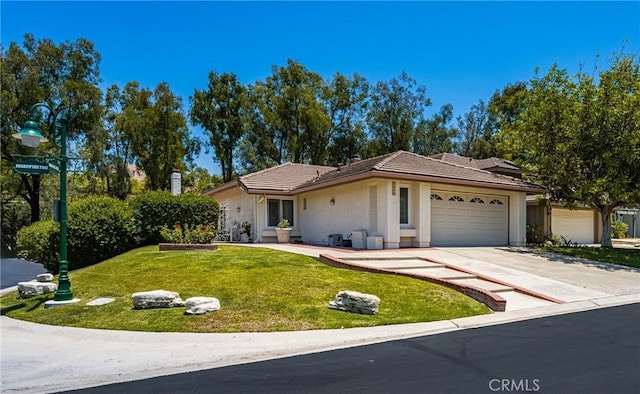 8009 E Eucalyptus Trl, Orange, CA 92869 - ranch-style home with a garage, driveway, a front lawn, a tile roof, and stucco siding