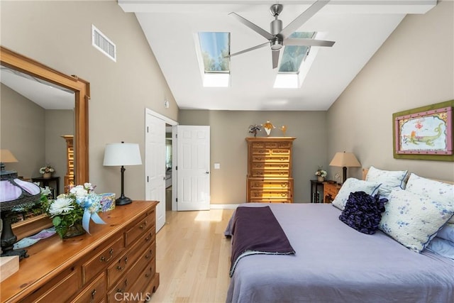 8009 E Eucalyptus Trl, Orange, CA 92869 - bedroom featuring vaulted ceiling, a skylight, light wood-type flooring, and a ceiling fan