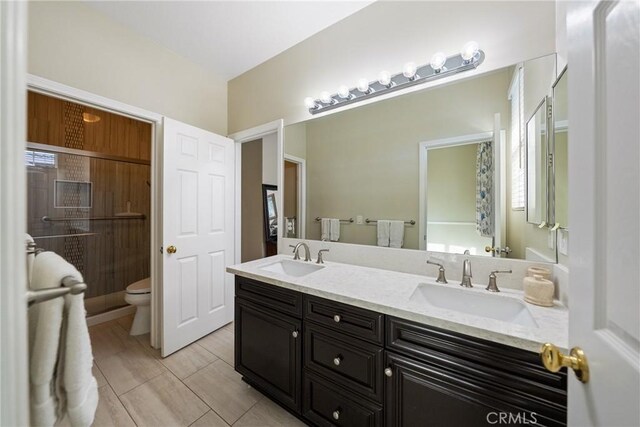 1708 Victoria Way, San Marcos, CA 92069 - bathroom featuring double vanity and toilet