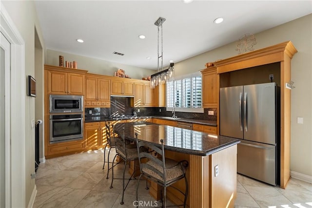 1708 Victoria Way, San Marcos, CA 92069 - kitchen with appliances with stainless steel finishes, backsplash, a breakfast bar area, a kitchen island, and recessed lighting