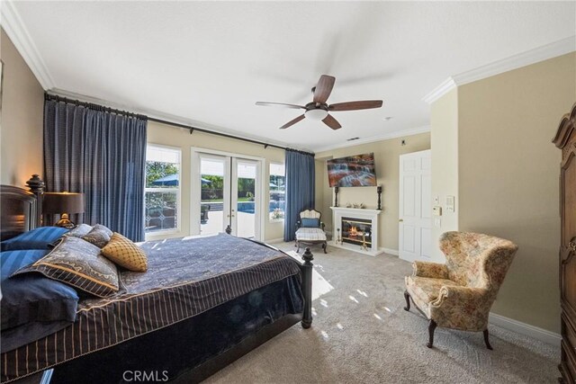 1708 Victoria Way, San Marcos, CA 92069 - bedroom with french doors, a glass covered fireplace, ornamental molding, carpet flooring, and ceiling fan
