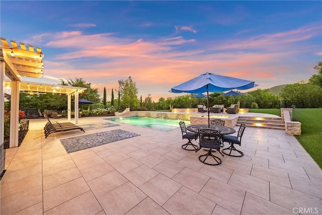 1708 Victoria Way, San Marcos, CA 92069 - patio terrace at dusk featuring a patio area, an outdoor pool, and an in-ground hot tub