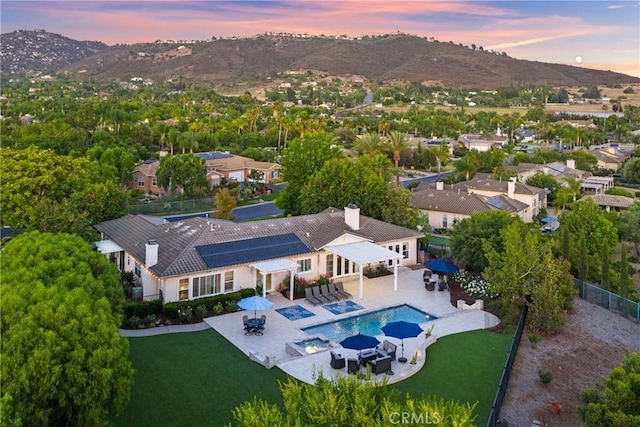1708 Victoria Way, San Marcos, CA 92069 - aerial view at dusk of a mountain view and view of pool