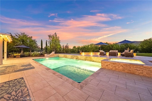 1708 Victoria Way, San Marcos, CA 92069 - pool at dusk featuring an in-ground hot tub, a patio, and a fire pit