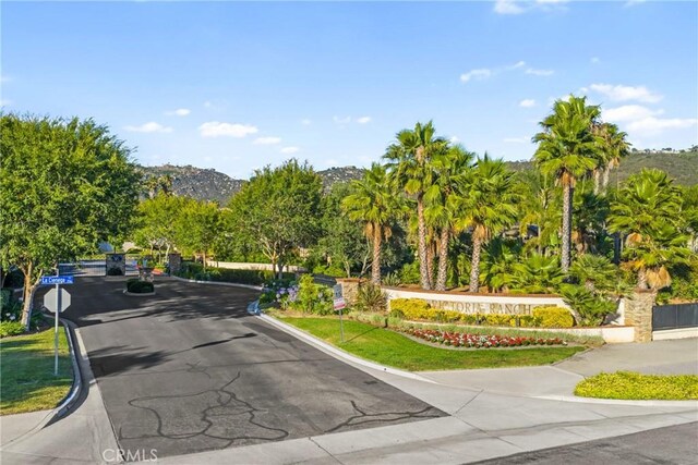 1708 Victoria Way, San Marcos, CA 92069 - view of asphalt street with traffic signs, curbs, and a mountain view