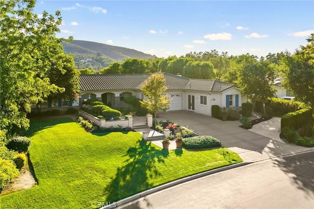 1708 Victoria Way, San Marcos, CA 92069 - mediterranean / spanish-style house with driveway, a tile roof, a garage, and a front lawn