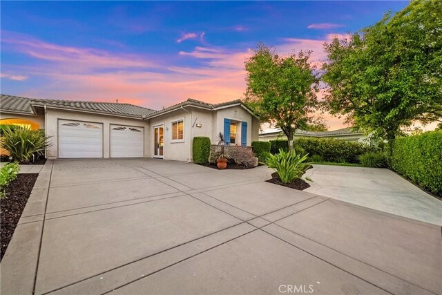 1708 Victoria Way, San Marcos, CA 92069 - view of front of property featuring an attached garage, a tiled roof, concrete driveway, and stucco siding