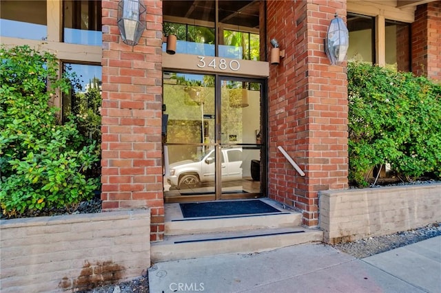 3480 Barham Blvd Unit 215, Los Angeles, CA 90068 - view of exterior entry featuring brick siding and french doors