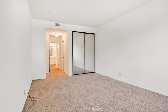 3480 Barham Blvd Unit 215, Los Angeles, CA 90068 - unfurnished bedroom featuring carpet flooring and a closet