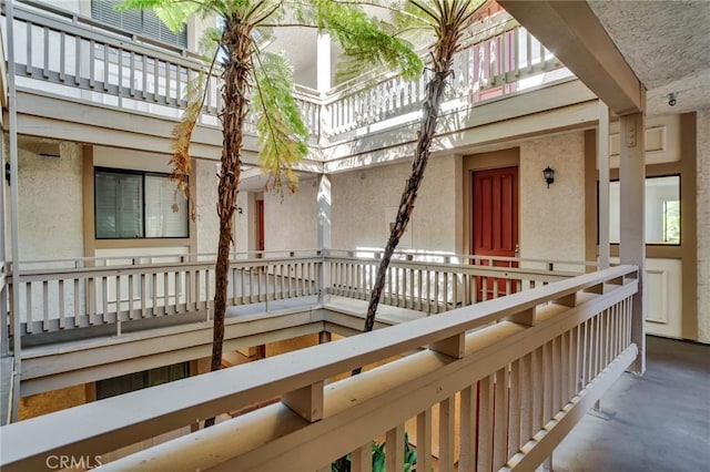 3480 Barham Blvd Unit 215, Los Angeles, CA 90068 - view of exterior entry with a balcony and stucco siding