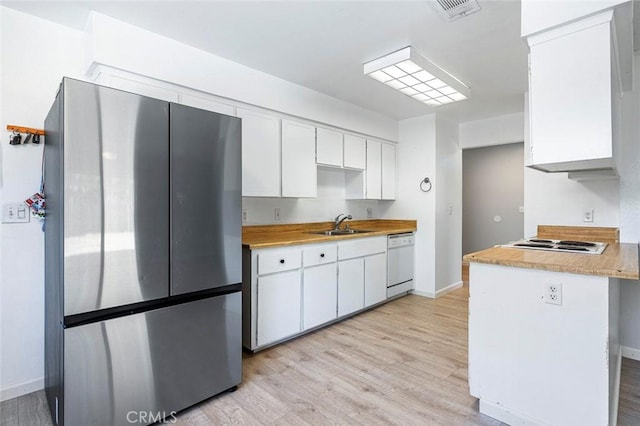 3318 Stanford Ave, Clovis, CA 93611 - kitchen with freestanding refrigerator, white dishwasher, white cabinets, and light wood-style flooring