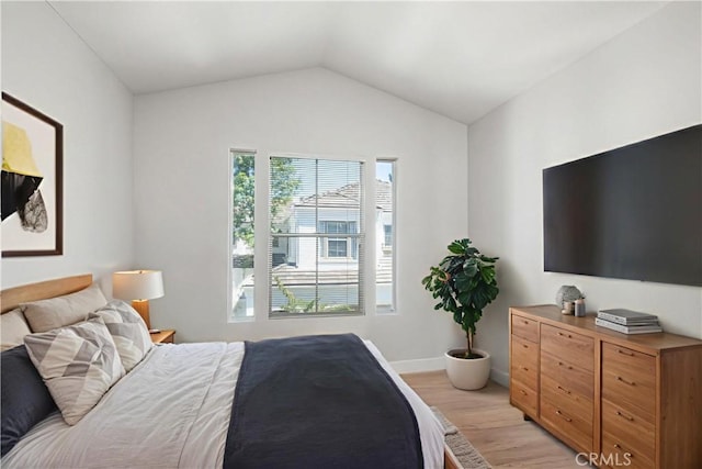 8 Diamant Way, Aliso Viejo, CA 92656 - bedroom with light wood-style flooring and vaulted ceiling