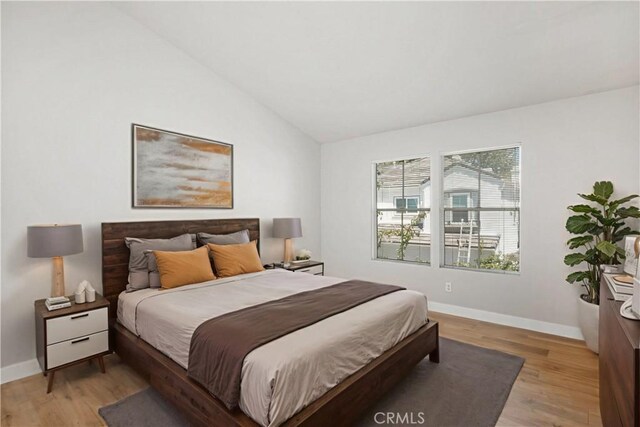 8 Diamant Way, Aliso Viejo, CA 92656 - bedroom featuring vaulted ceiling and light wood-style flooring
