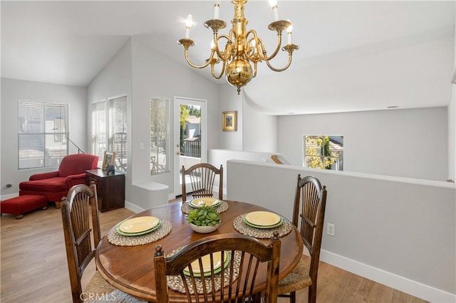 8 Diamant Way, Aliso Viejo, CA 92656 - dining area with a chandelier, light wood-style flooring, and vaulted ceiling