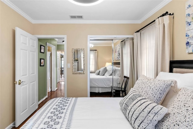 4328 Sunset Ave, Montrose, CA 91020 - bedroom featuring crown molding, a closet, and wood finished floors