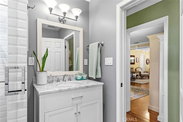 4328 Sunset Ave, Montrose, CA 91020 - bathroom featuring wood finished floors, vanity, and crown molding