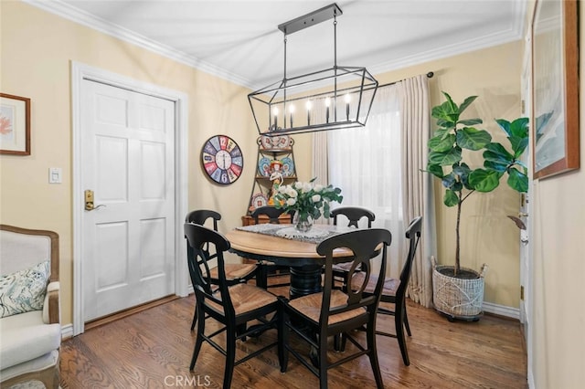 4328 Sunset Ave, Montrose, CA 91020 - dining space with dark wood-type flooring, ornamental molding, and a chandelier