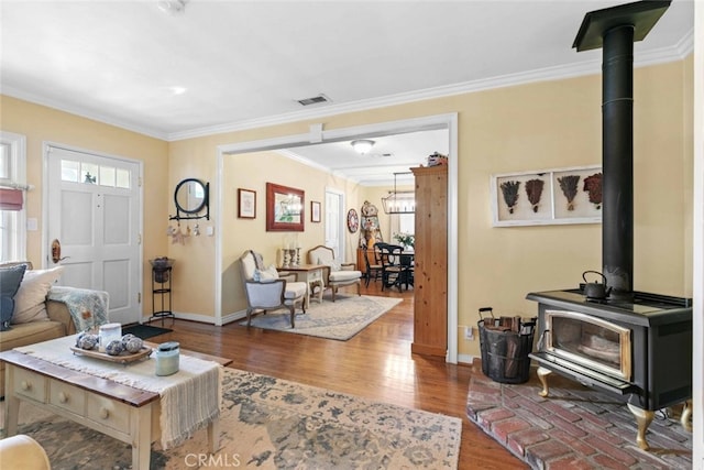 4328 Sunset Ave, Montrose, CA 91020 - living area featuring a wood stove, ornamental molding, and wood finished floors