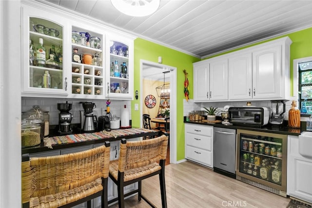 4328 Sunset Ave, Montrose, CA 91020 - kitchen featuring backsplash, white cabinetry, glass insert cabinets, and dark countertops