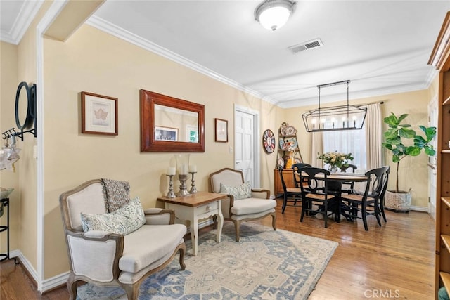 4328 Sunset Ave, Montrose, CA 91020 - dining area featuring wood finished floors, ornamental molding, and a chandelier
