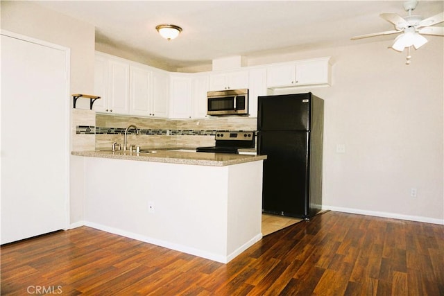3550 Ruffin Rd Unit 142, San Diego, CA 92123 - kitchen with stainless steel appliances, dark wood-style flooring, tasteful backsplash, a peninsula, and ceiling fan