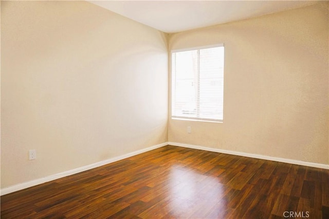 3550 Ruffin Rd Unit 142, San Diego, CA 92123 - spare room featuring baseboards and dark wood-style flooring