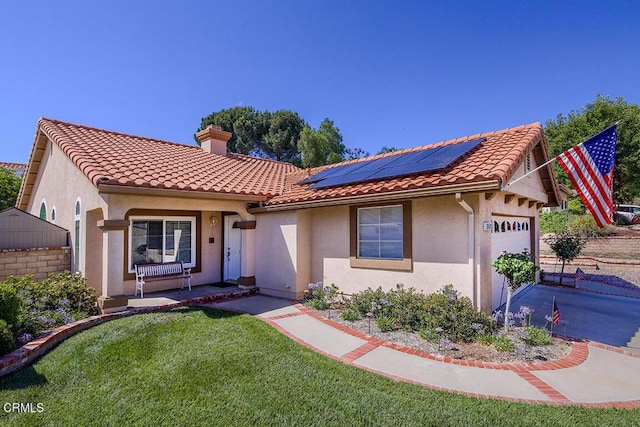 20325 Tamara Pl, Santa Clarita, CA 91350 - mediterranean / spanish-style home featuring solar panels, an attached garage, a chimney, and a tile roof