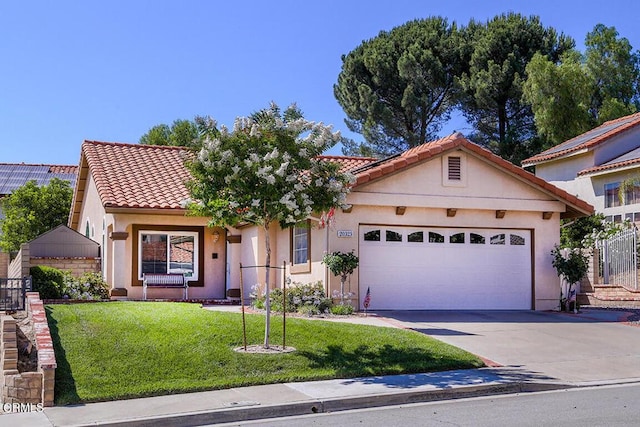 20325 Tamara Pl, Santa Clarita, CA 91350 - mediterranean / spanish-style home with a garage, concrete driveway, a front yard, and stucco siding
