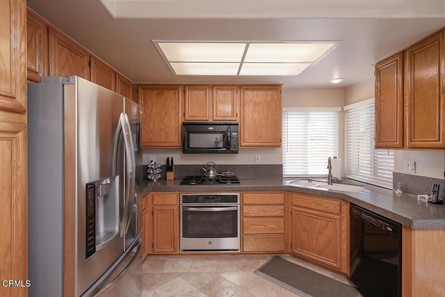 20325 Tamara Pl, Santa Clarita, CA 91350 - kitchen with black appliances, dark countertops, and brown cabinets