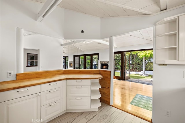 490 Agate, Laguna Beach, CA 92651 - kitchen with open shelves, open floor plan, wooden counters, white cabinets, and a wooden ceiling with exposed beams