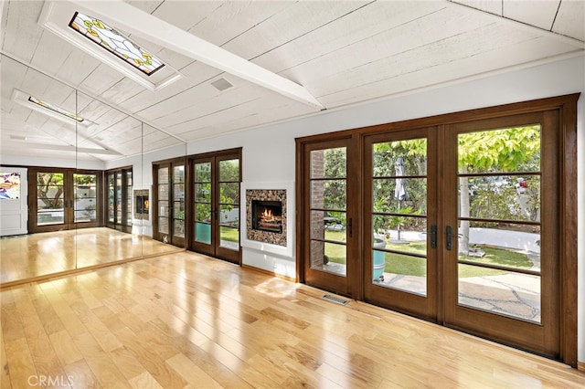 490 Agate, Laguna Beach, CA 92651 - doorway featuring french doors, a skylight, wood finished floors, and wooden ceiling