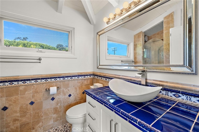 490 Agate, Laguna Beach, CA 92651 - full bath featuring tile walls, a stall shower, vanity, plenty of natural light, and a wainscoted wall