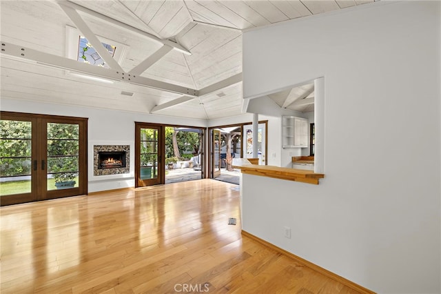 490 Agate, Laguna Beach, CA 92651 - unfurnished living room featuring french doors, wood finished floors, and high vaulted ceiling