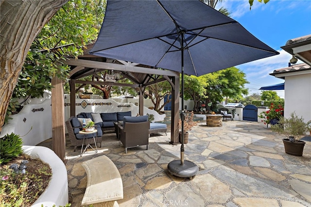 490 Agate, Laguna Beach, CA 92651 - fenced backyard with a shed, a gazebo, an outdoor living space with a fire pit, and a patio area