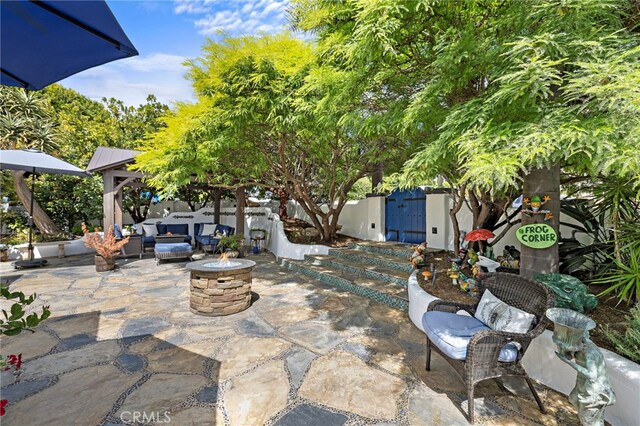490 Agate, Laguna Beach, CA 92651 - view of patio with an outdoor living space with a fire pit, a gate, and a gazebo