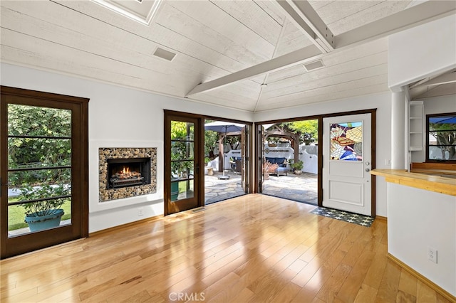 490 Agate, Laguna Beach, CA 92651 - entryway with hardwood / wood-style floors, wood ceiling, plenty of natural light, and a lit fireplace