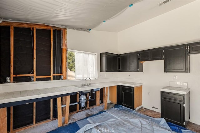9304 Palo Verde Dr, Hesperia, CA 92344 - kitchen featuring dark cabinets