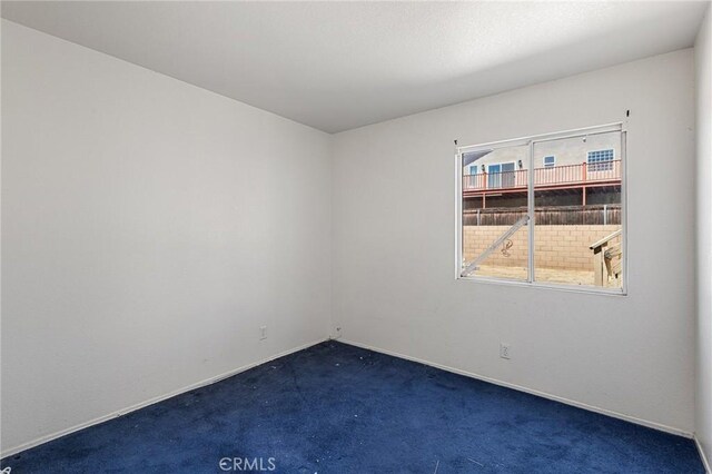 9304 Palo Verde Dr, Hesperia, CA 92344 - empty room with carpet floors and baseboards