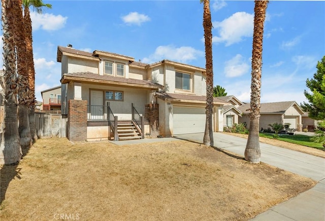 9304 Palo Verde Dr, Hesperia, CA 92344 - view of front of property with stucco siding, an attached garage, and driveway