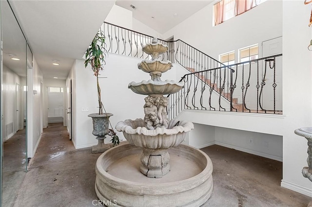 9304 Palo Verde Dr, Hesperia, CA 92344 - stairway with concrete floors and a high ceiling