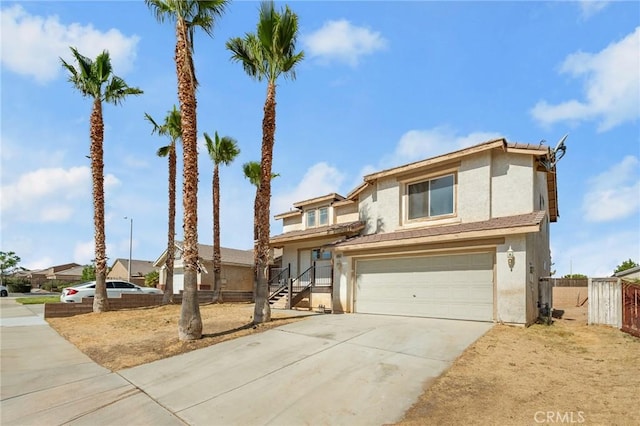 9304 Palo Verde Dr, Hesperia, CA 92344 - view of front of property with stucco siding, an attached garage, and concrete driveway