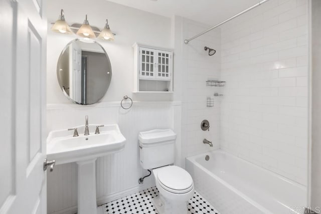 8004 Caminito Gianna, La Jolla, CA 92037 - full bath featuring  shower combination, a wainscoted wall, and tile patterned flooring