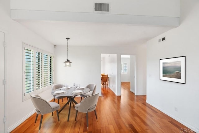 8004 Caminito Gianna, La Jolla, CA 92037 - dining area with light wood-style flooring and beamed ceiling