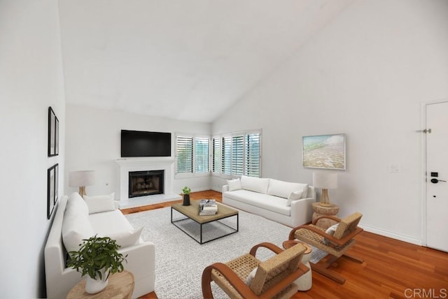 8004 Caminito Gianna, La Jolla, CA 92037 - living area with wood finished floors, high vaulted ceiling, and a glass covered fireplace