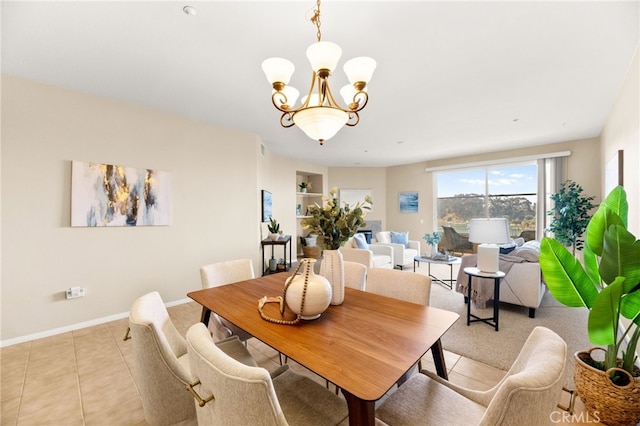 4025 Canario St Unit 142, Carlsbad, CA 92008 - dining area featuring a chandelier, light tile patterned floors, and built in features