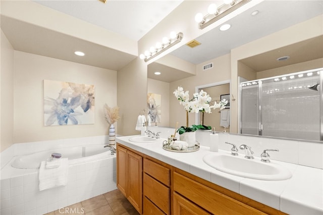 4025 Canario St Unit 142, Carlsbad, CA 92008 - full bath with tile patterned floors, double vanity, a bath, a shower stall, and recessed lighting