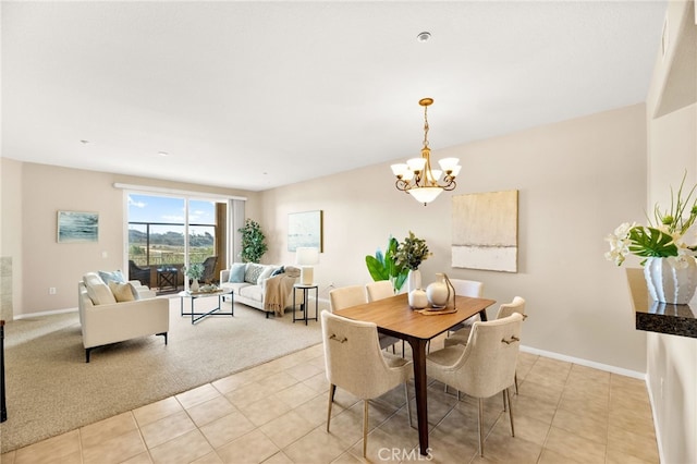 4025 Canario St Unit 142, Carlsbad, CA 92008 - dining area featuring a chandelier, light tile patterned floors, and light colored carpet